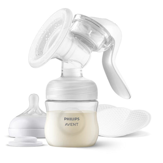 Philips Avent breast pump set with a clear manual breast pump, clear storage bottle filled with milk, a white bottle cap, a silicone nipple, and two white cleaning pads on a white background.